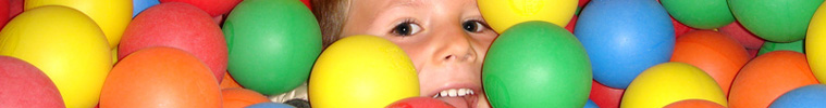 child in a ball pit