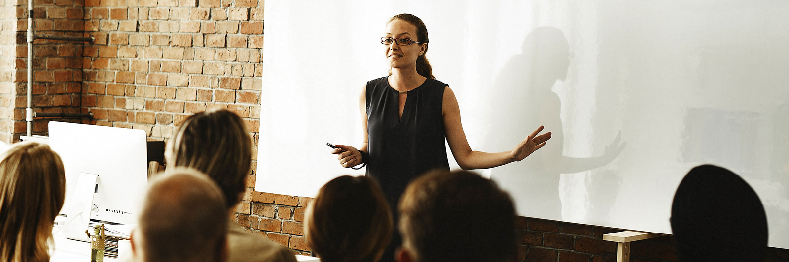 a female trainer teaching a group of learners