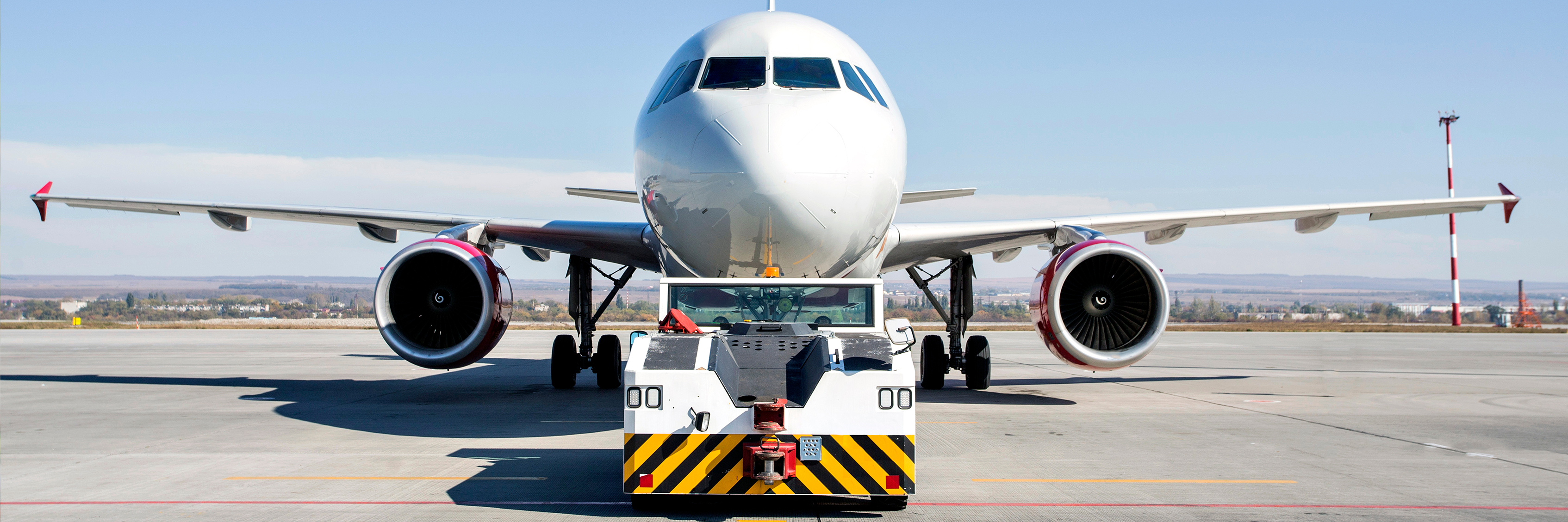 an aircraft being moved by a tug